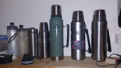 some thermos bottles and bike bottles
